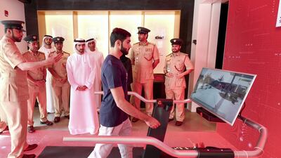 A man demonstrates how to use the Smart Police Station during its inauguration by Sheikh Hamdan bin Mohammed. Dubai Media Office / Wam