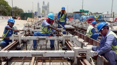 Infrastructure spending on projects such as the Dubai Metro ahead of Expo 2020 is predicted to drive growth. Marwan Naamani / AFP