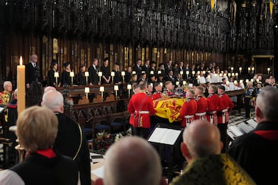 Members of the royal family watch as the bearer party place the coffin of Queen Elizabeth upon the catafalque at St George's Chapel in Windsor Castle. Getty Images