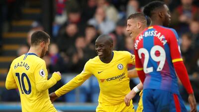 Chelsea's N'Golo Kante celebrates with Eden Hazard after scoring against Crystal Palace. Reuters