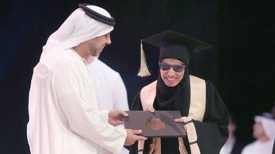Sheikh Mansour bin Zayed, Deputy Prime Minister and Minister of Presidential Affairs, with Wafa Awadh who, despite being blind from birth, was one of the top pupils at the Grade 12 Best Achievers Award Ceremony at Emirates Palace. Delores Johnson / The National