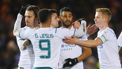 Riyad Mahrez celebrates with teammates Joao Cancelo, Jack Grealish, Gabriel Jesus and Oleksandr Zinchenko. Getty