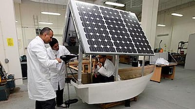 Dr Mahmoud Abu Shammeh, the head of Sharjah University’s central laboratory, runs tests with Aalal al Othman and Kareem Kamal.