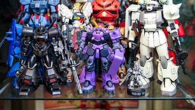 Gunpla model kits depicting the vehicles and characters of the fictional Gundam multiverse