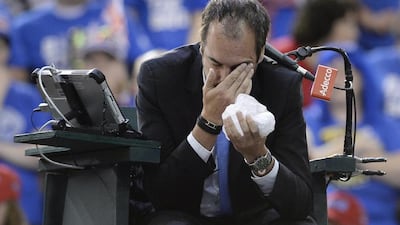 Umpire Arnaud Gabas, of France, holds his face after being hit by a ball during a Davis Cup match between Canada's Denis Shapovalov and Great Britain's Kyle Edmund on Sunday in Ottawa. Justin Tang / AP Photo