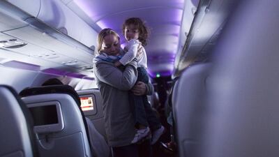 Introducing child-free zones on flights is impractical, readers say. Robert Nickelsberg / Getty Images
