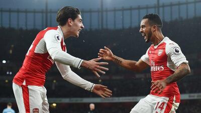 Hector Bellerin, left, created Theo Walcott's equalising goal for Arsenal in the 3-1 victory over Stoke City. Andy Rain / EPA