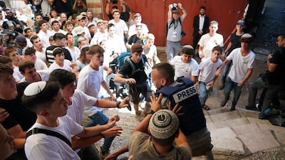 Palestinian journalist Saif Al Qawasmi is attacked by young Israeli ultranationalists during the Flag March in Jerusalem. Photo: Maya Levin / X