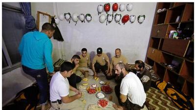Syrian civil defence members breaking fast in the rebel-controlled area of Maaret Al Numan town, in Idlib province, Syria on June 10, 2016. Photo by Khalil Ashawi