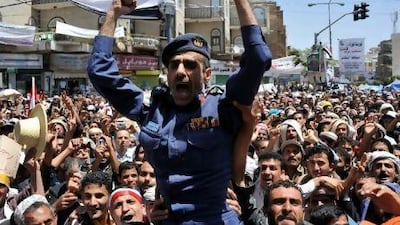 Anti-government demonstrators carry a Yemeni army officer as he joins demonstrations demanding the departure of President Ali Abdullah Saleh during a demonstration in Sana'a yesterday.