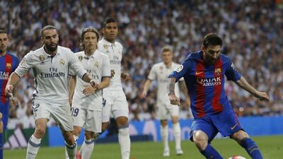 Barcelona's Lionel Messi celebrates after scoring the winning goal against Real Madrid at the Santiago Bernabeu stadium in Madrid on April 23, 2017. Gerard Julien / AFP