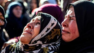 Relatives mourn at a funeral for two Syrian Democratic Forces (SDF) fighters in the Syrian Kurdish-majority city of Qamishli, after they were killed by a Turkish drone, according to Kurdish security officials. AFP