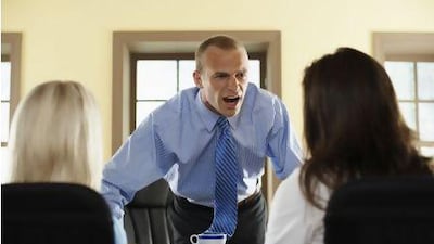 An executive yells at his staff - the guide could classify him as suffering from a personality disorder. Tim Pannell / Corbis