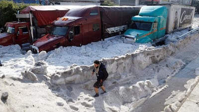 A man walks as hail covers the streets in Guadalajara, Mexico. EPA