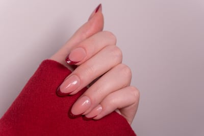 Try a creative French tip in a warm winter shade during your next manicure. Getty Images