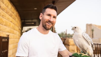 Lionel Messi holds a falcon during a recent family trip to Saudi Arabia, where he is a tourism ambassador for the country. Photo: Saudi Tourism Authority