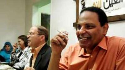 Alaa al Aswany, the Egyptian author of the best-selling novel The Yacoubian Building, speaks at a book signing for a friend in Cairo.