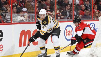 Patrik Berglund, No 21, of the St Louis Blues, controls the puck against Joe Pavelski, No 8, of the San Jose Sharks, at the Scottrade Center.