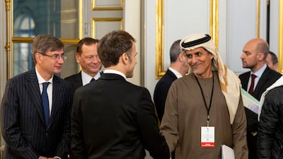 Ali Al Shamsi, Secretary General of the UAE Supreme Council for National Security, is greeted by Mr Macron. Ryan Carter / UAE Presidential Court