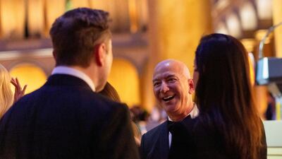 Amazon chief executive Jeff Bezos, centre, and Tesla and X owner Elon Musk attend a dinner hosted by US president-elect Donald Trump, at the National Building Museum in Washington. Reuters