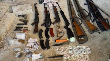 Drugs, cash and arms seized during a raid on a Captagon production lab in Tal Al Abyad, in the Baalbek region of Lebanon. Photo: Lebanese Internal Security Forces