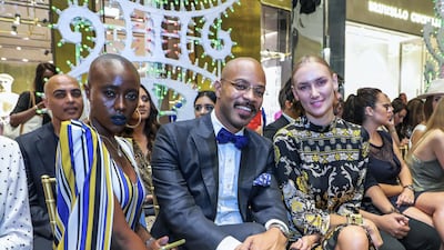 Winnie Carine, David Charvalho and Mango Dedova attend the Dolce & Gabbana Fashion Show in Dubai Mall. All photos by Victor Besa / The National