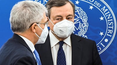 Italy's Prime Minister Mario Draghi, right, pictured with Economy Minister Daniele Franco, says the stimulus package is 'partial', but 'the best we can do'. Reuters