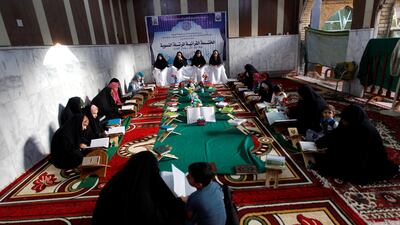 Women read the Quran at Al Qasim Mosque during the blessed month of Ramadan in the central Iraqi city of Hilla. Reuters