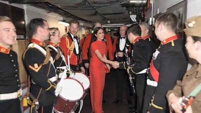 Prince Harry and Meghan, Duchess of Sussex, meet band members as they attend the Mountbatten Music Festival at the Royal Albert Hall in March 2020. Getty Images
