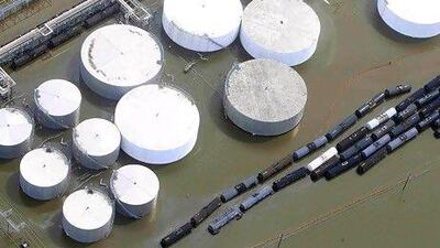 Oil storage containers in Louisiana lie partially submerged in flood waters after Hurricane Isaac. Sean Gardner / Reuters