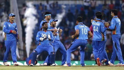 Afghanistan's cricketers celebrate their win over West Indies in the World Twenty20 on Sunday in Nagpur. Saurabh Das / AP / March 27, 2016