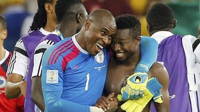 Nigeria's Vincent Enyeama, left, celebrates with Ogenyi Onazi after a win over Bosnia at the 2014 World Cup in Brazil. Eric Gaillard / Reuters