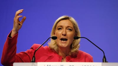 French far-right National Front party leader Marine Le Pen delivers her speech during a meeting as part of the up coming European elections in Marseille on March 20. Claude Paris / AP