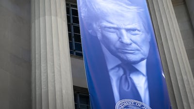 US President Donald Trump's image at the US Department of Justice in Washington. Joshua Longmore / The National