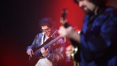Kamal Mussallam, right, on stage last night as the Womad festival kicks off on the Abu Dhabi Corniche.