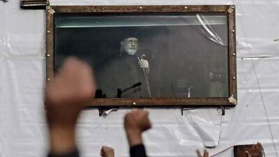 Pakistani Sunni cleric Tahir Ul Qadri addresses his supporters from a bullet-proof container during an anti-government rally in Islamabad.