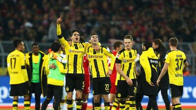 Borussia Dortmund players from left: Marc Bartra, Christian Pulisic, and Matthias Ginter celebrate after the 1-0 win over Bayern Munich in Dortmund, Germany, November 19, 2016. Ina Fassbender / EPA