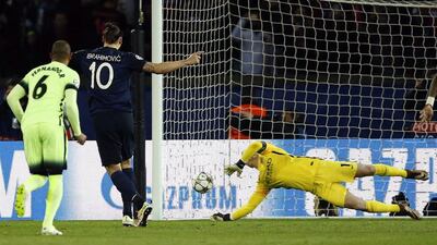 Manchester City goalkeeper Joe Hart stops a penalty kick by Zlatan Ibrahimovic of Paris Saint-Germain (2nd L) during the Uefa Champions League quarter final first leg football match between Paris Saint-Germain and Manchester City FC at the Parc des Princes Stadium in Paris, France, 06 April 2016. EPA/GUILLAUME HORCAJUELO