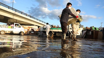 Residents remove muddy items from their flood-damaged homes in Koriyama, Fukushima prefecture after Typhoon Hagibis hit Japan on October 12 unleashing high winds, torrential rain and triggered landslides and catastrophic flooding. Rescuers in Japan worked into a third day in an increasingly desperate search for survivors of a powerful typhoon that killed nearly 70 people and caused widespread destruction. AFP