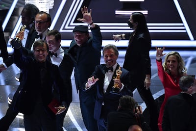 Stars of 'Coda' accept the Best Picture Award on stage at the Oscars. AFP