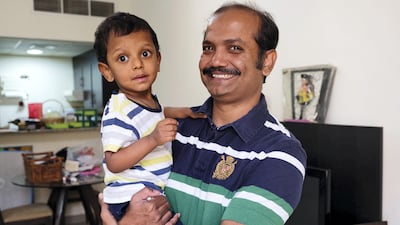 Valerian Dias with his son Aldin, whose hospital bill topped Dh1.3 million after he was born prematurely. His twin sister died after seven months in intensive care. Anna Nielsen for The National