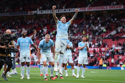 Enzo Fernandez leads the City celebrations after beating United in the Manchester derby. EPA