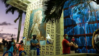 Voters line up at the John F. Kennedy Library, a Miami-Dade County polling station, during the 2020 U.S. presidential election in Miami, Florida. Reuters