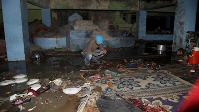 A Pakistani security official examines the site of bomb blast at the shrine of Sufi saint Shah Bilal Noorani in Khuzdar district, some 200 kilometers west of Karachi, Pakistan on November 13, 2016, a day after the blast kills more than 50. Shakil Adil / AP Photo