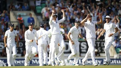 England players celebrate after dismissing India and winning the five-Test series 3-1 at The Oval in London on August 17, 2014. Alastair Grant / AP Photo