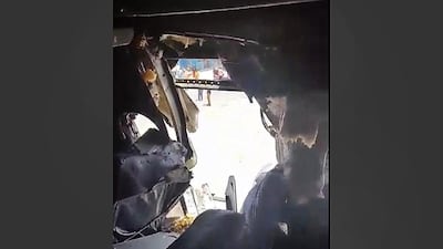 A hole is photographed from inside the Daallo Airlines plane that was forced to make an emergency landing at the airport in Mogadishu, Somalia on February 2, 2016 after a blast set off by a suspected suicide bomber ripped a hole in the fuselage. Awale Kullane / AP