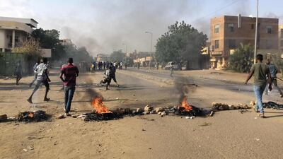 Tyres are set ablaze by Sudanese protesters. AFP