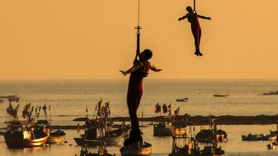 Indian marine commandos demonstrate their rescue operation skills during Navy Day celebrations in Mumbai. Photo: EPA