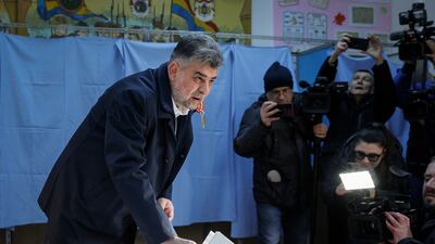 Romanian Prime Minister Marcel Ciolacu casts his vote in Buzau. AP