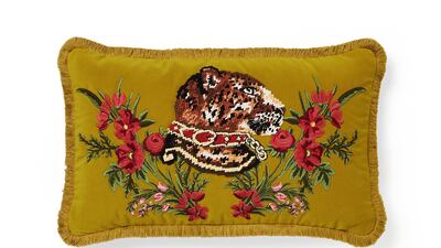 The cushions have contrasting backs, crafted from jacquard, and fronts, made from velvet, with motifs such as roses, snakes and big cats, as seen here. Courtesy Gucci